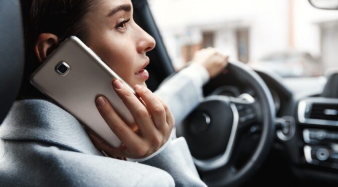 someone phone woman sitting driver