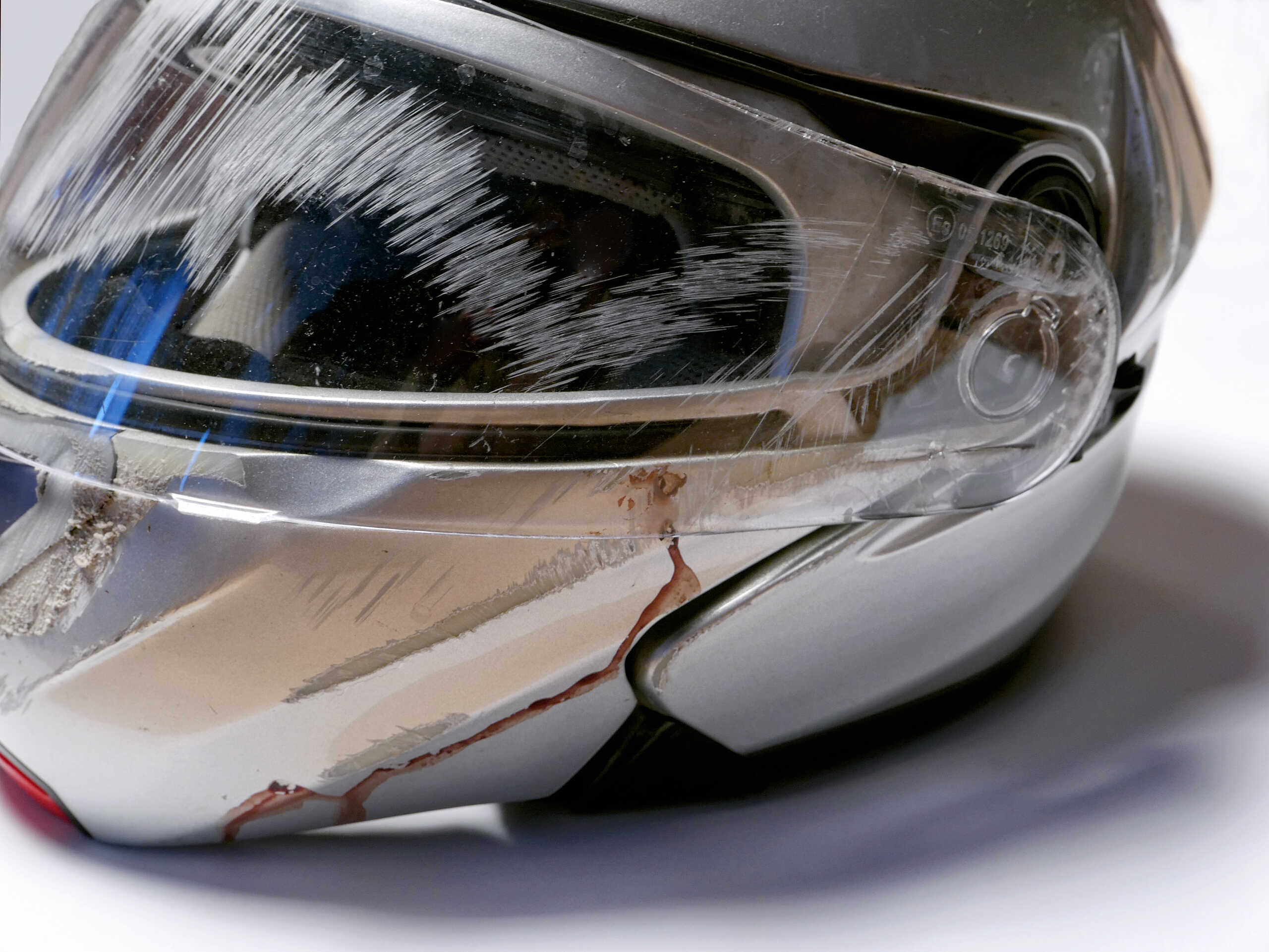 Scratched motorcycle helmet illustrating Fort Worth motorcycle accident statistics.