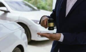 Dallas car accident lawyer explaining legal options after a vehicle crash with gavel and cars in the background.