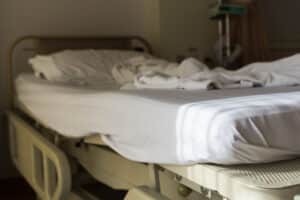 An empty hospital bed in Dallas representing the basis for a survival action claim.